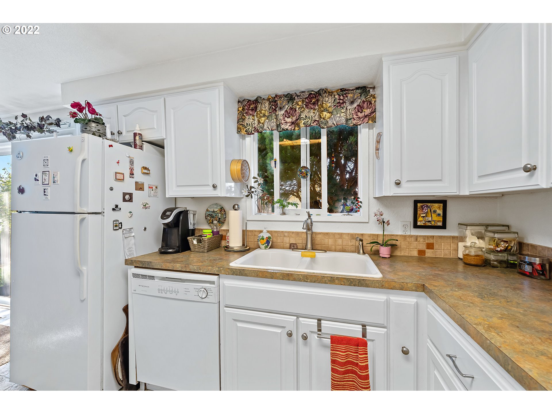 4225 Orchard Loop Netarts, OR 97141 - Photo 12 of 31 a kitchen with refrigerator and cabinets