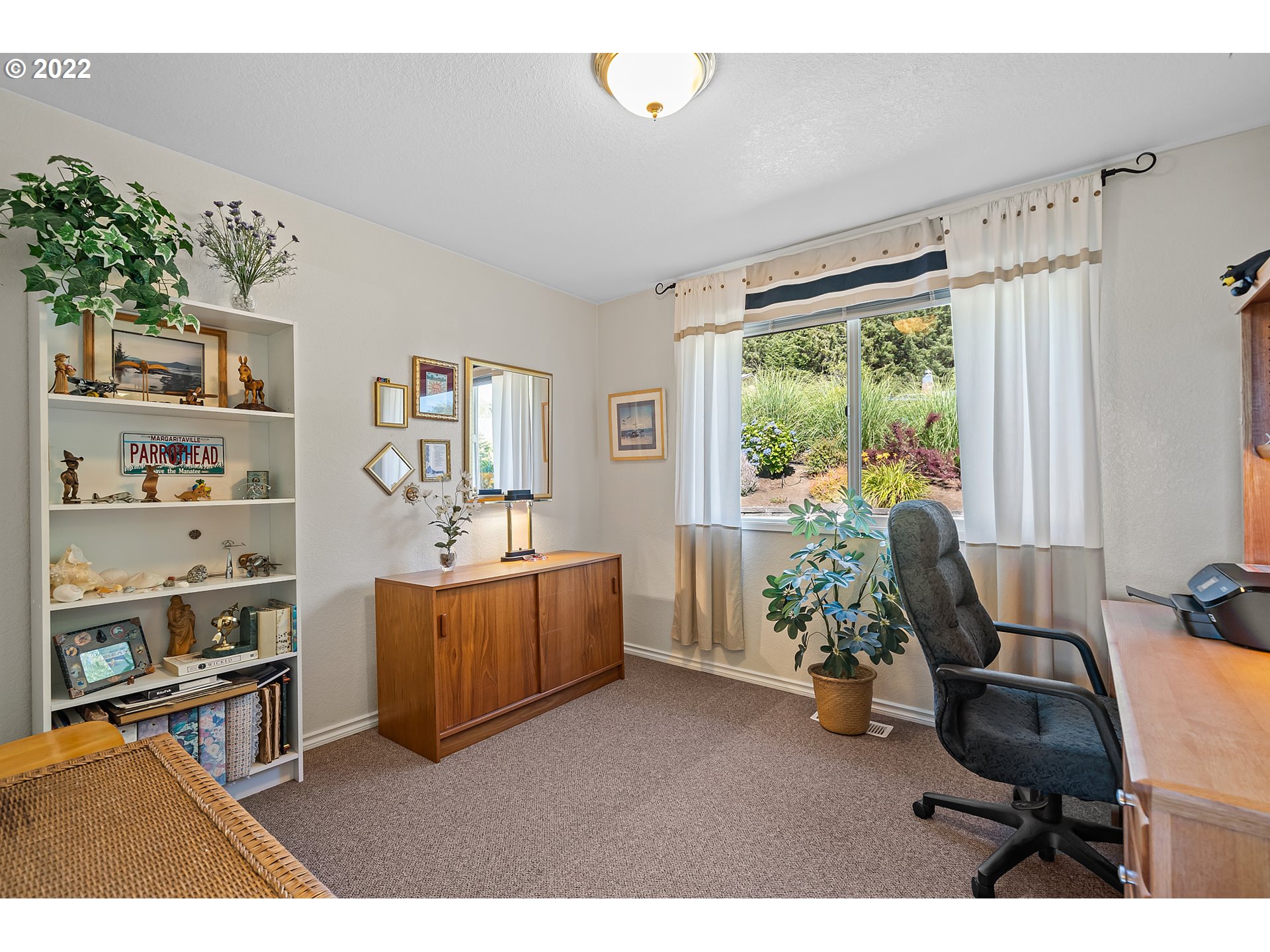 4225 Orchard Loop Netarts, OR 97141 - Photo 20 of 31 a living room with furniture and a large window