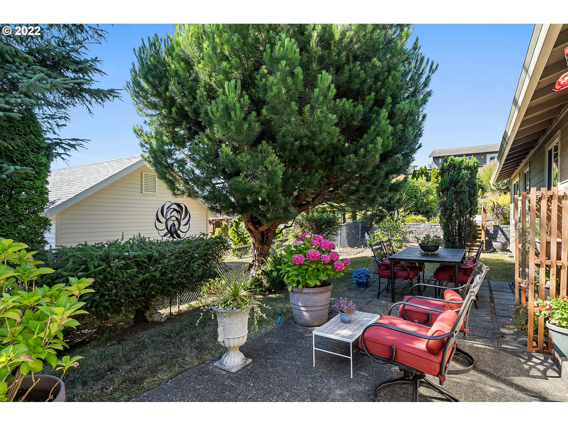 4225 Orchard Loop Netarts, OR 97141 - Photo 21 of 31 a backyard of a house with outdoor seating