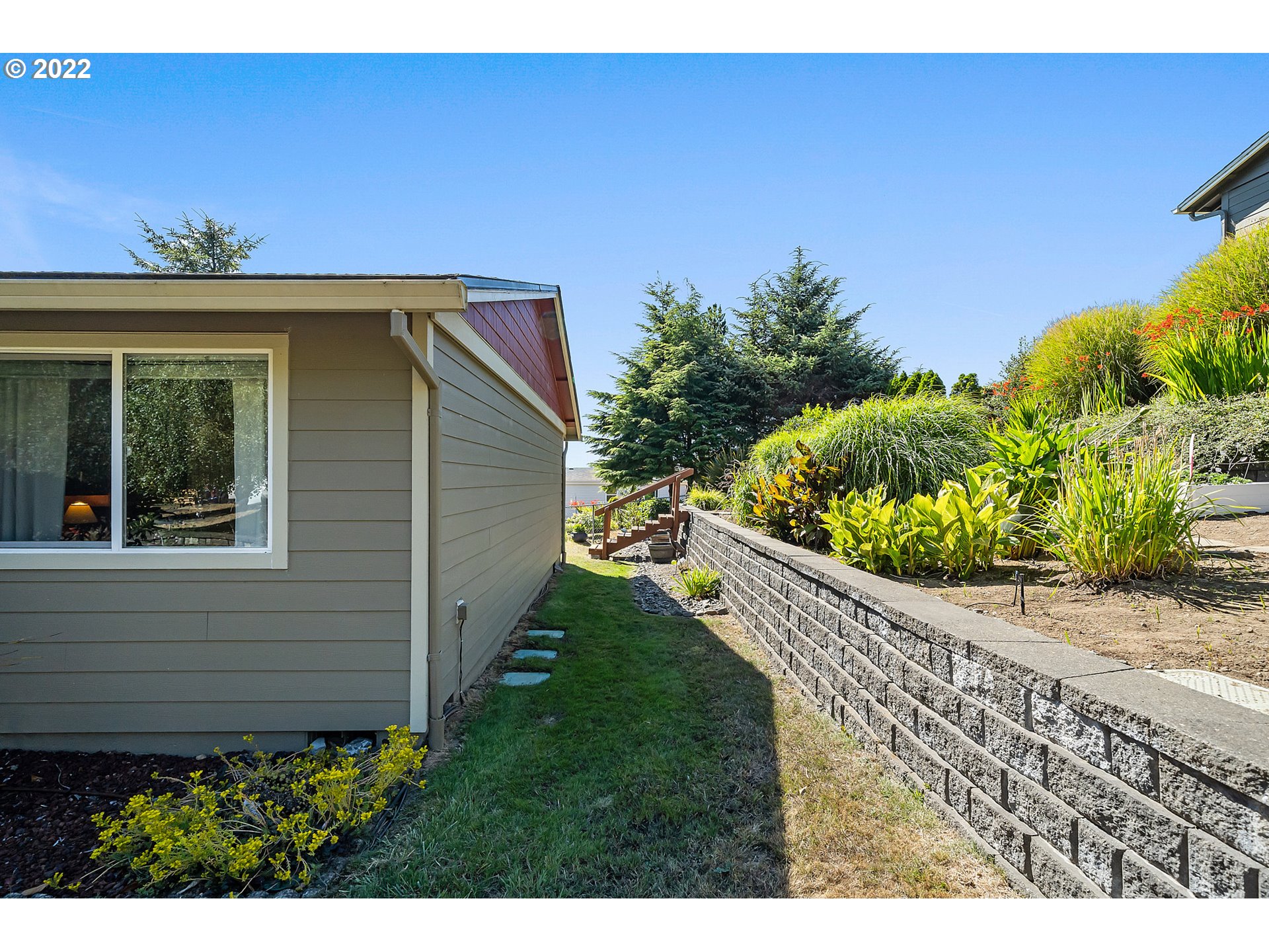 4225 Orchard Loop Netarts, OR 97141 - Photo 24 of 31 a view of a backyard with potted plants