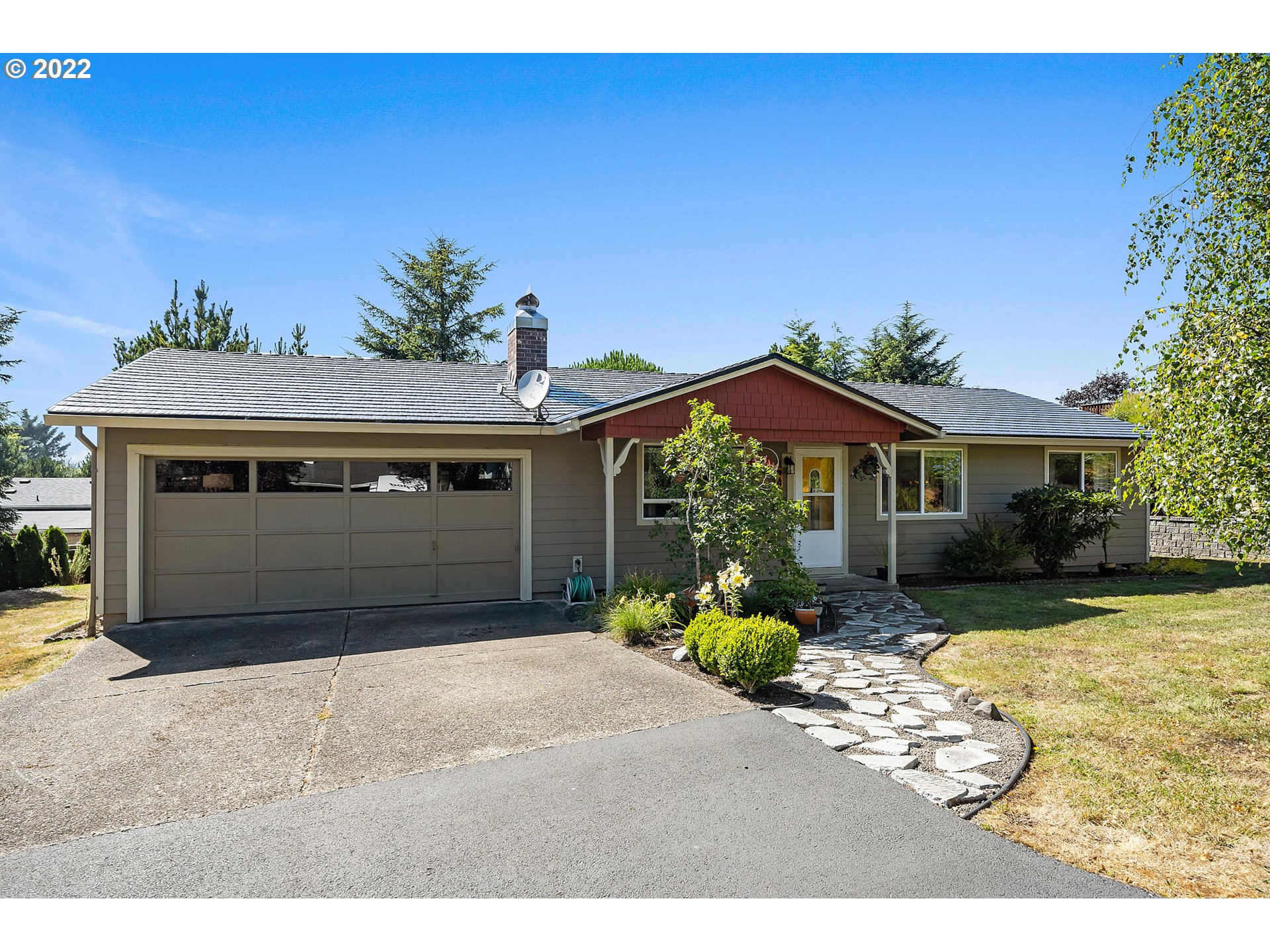 4225 Orchard Loop Netarts, OR 97141 - Photo 30 of 31 a front view of a house with a yard and garage