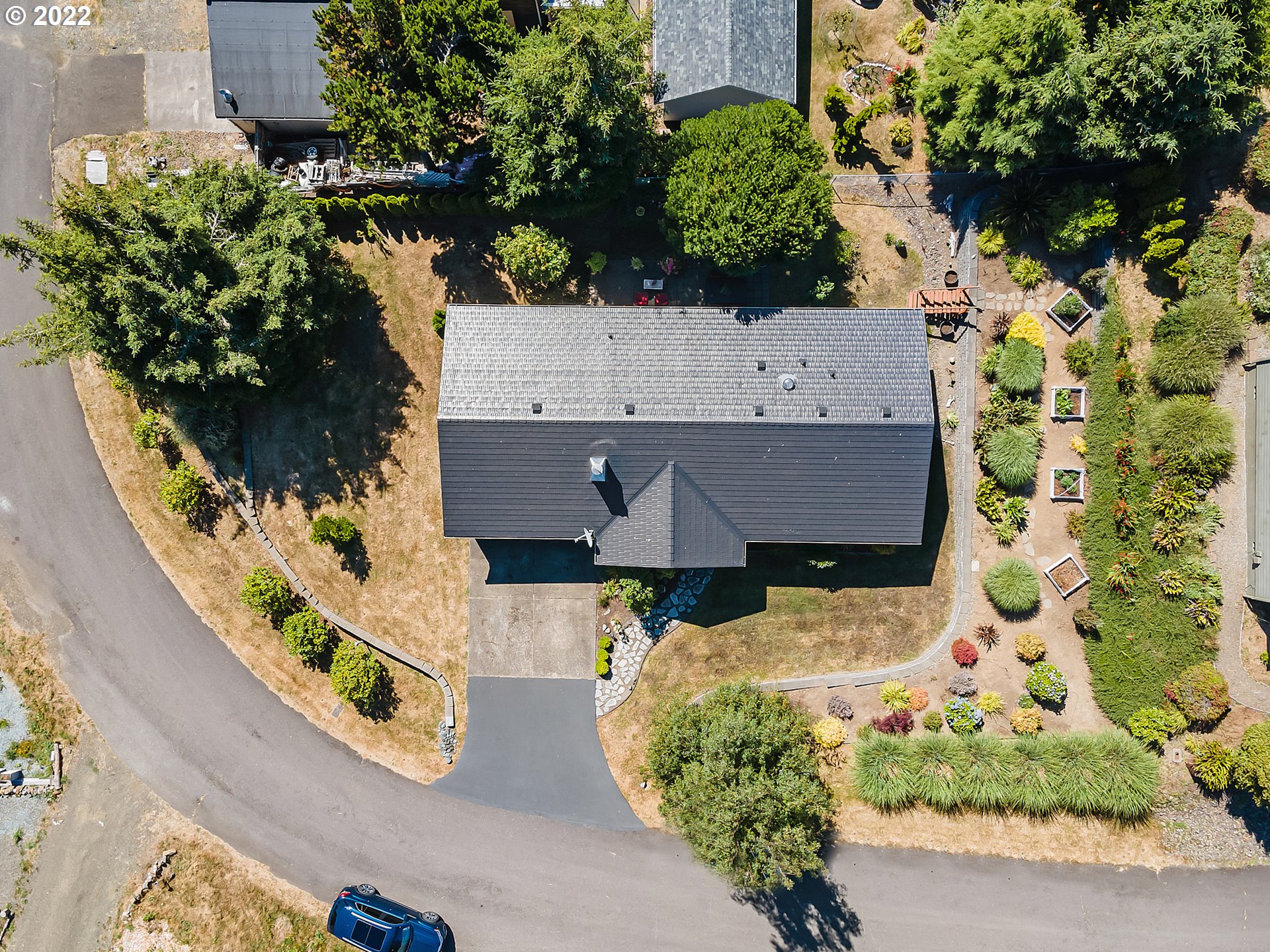4225 Orchard Loop Netarts, OR 97141 - Photo 3 of 31 an aerial view of a house with a yard and large trees