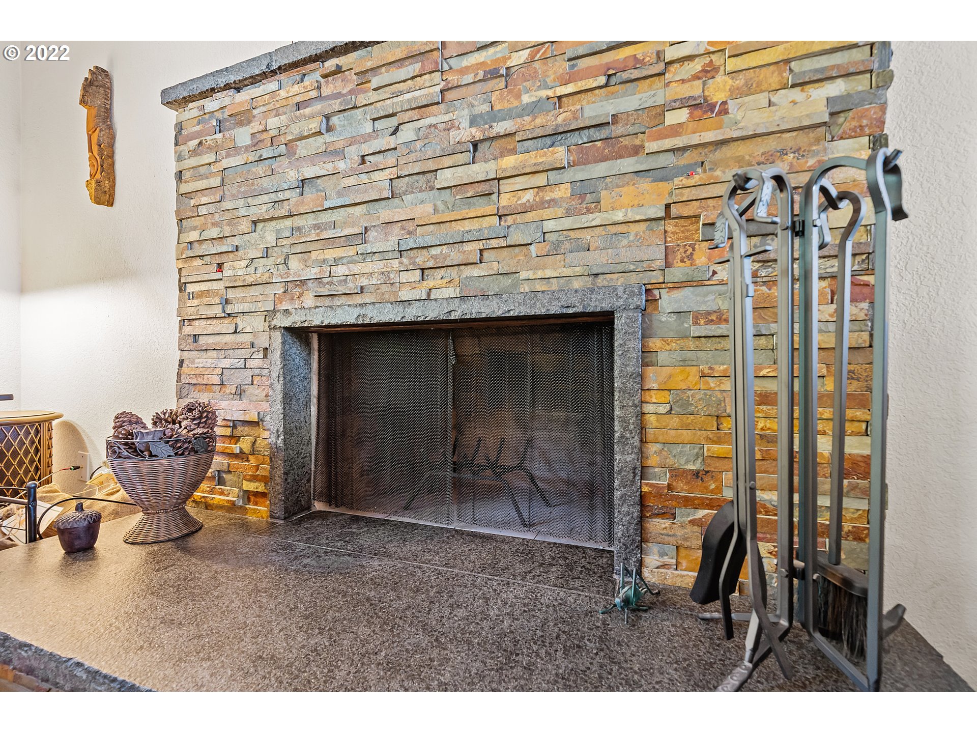 4225 Orchard Loop Netarts, OR 97141 - Photo 7 of 31 a bedroom with a bed and a fireplace