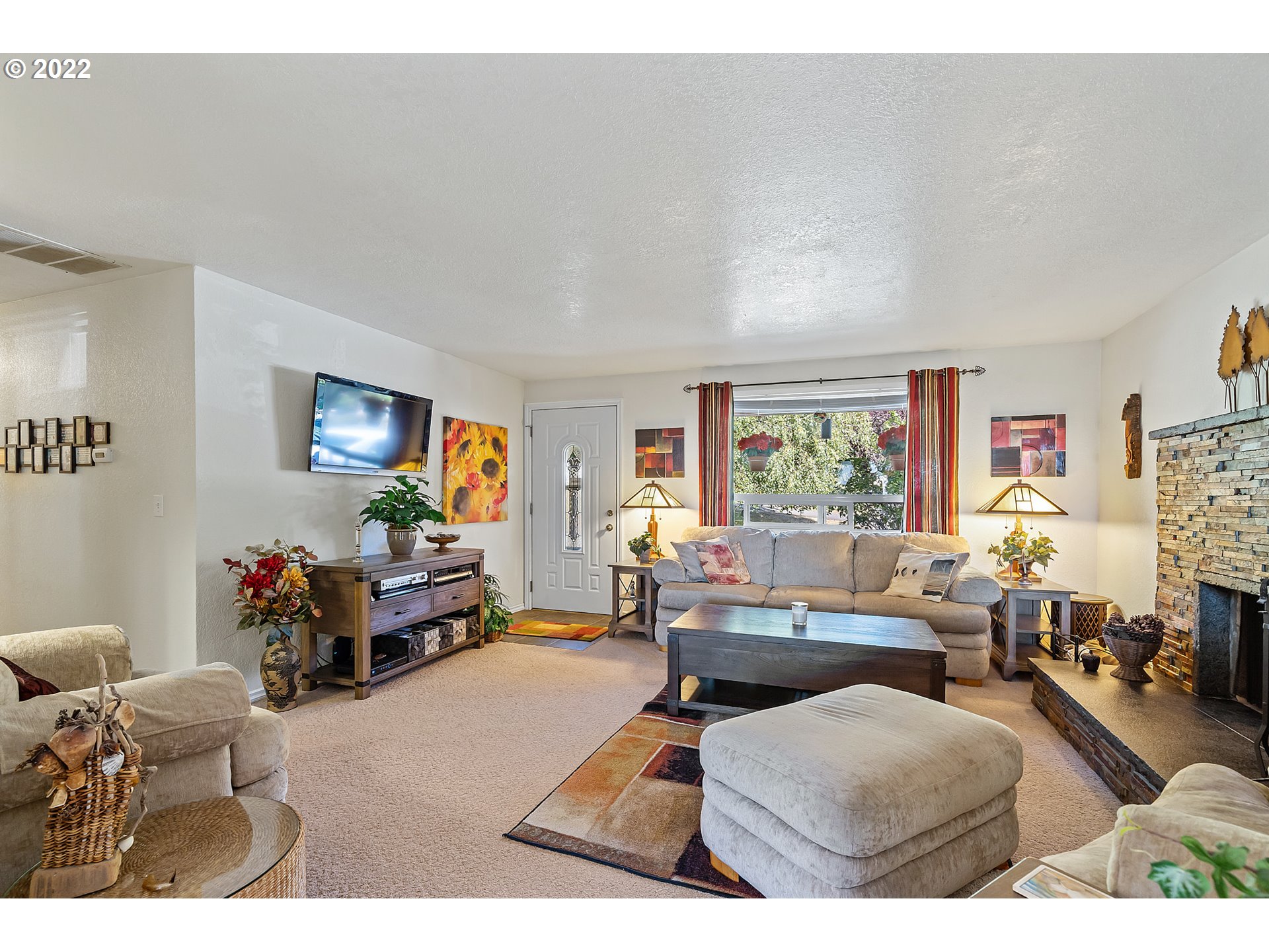 4225 Orchard Loop Netarts, OR 97141 - Photo 8 of 31 a living room with furniture and a flat screen tv