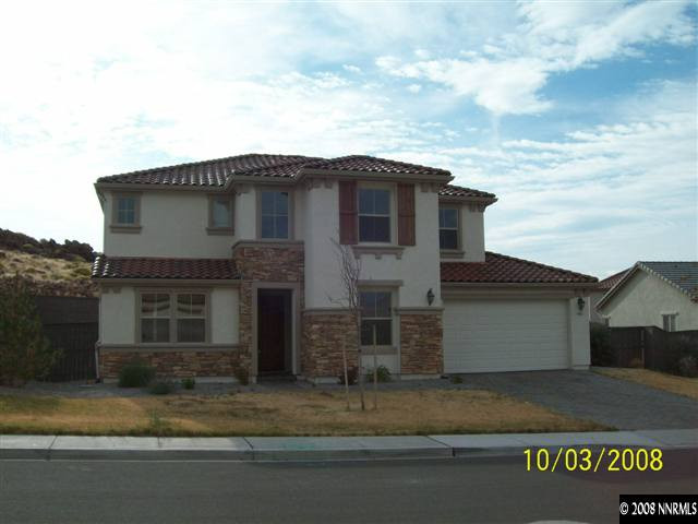 960 North University Park Loop Reno, NV 89512 - Photo 1 of 9 a front view of a house with a yard