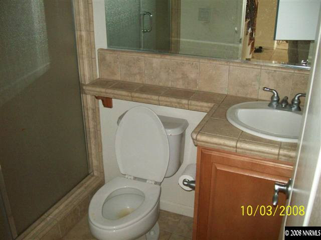 960 North University Park Loop Reno, NV 89512 - Photo 3 of 9 a bathroom with a toilet sink and mirror