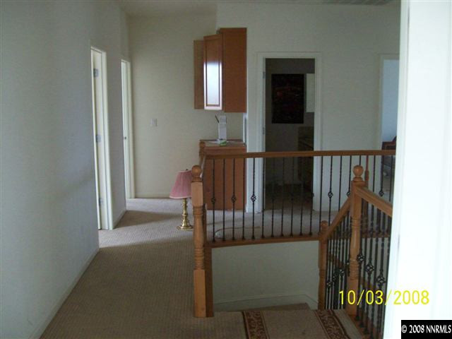 960 North University Park Loop Reno, NV 89512 - Photo 5 of 9 a view of a hallway with wooden floor and windows