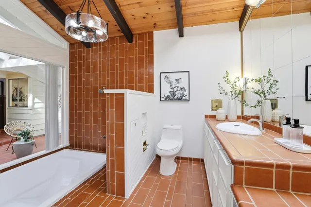 a bedroom with a large bed and a large window