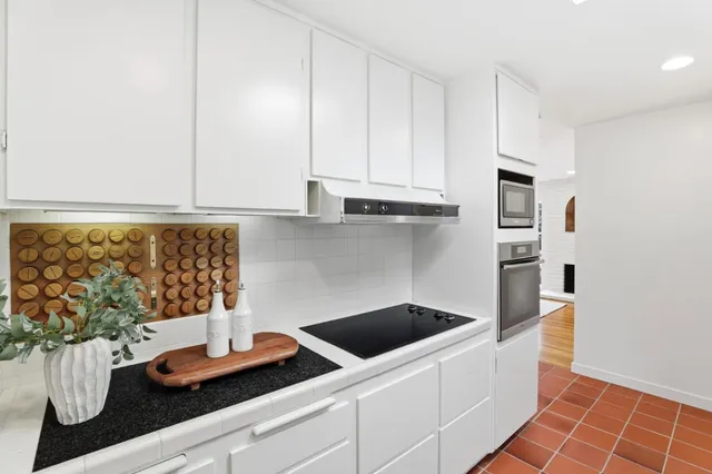 a bathroom with a sink a washer and dryer