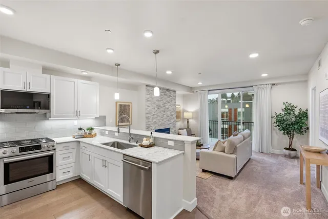 a kitchen with stove a sink and cabinets