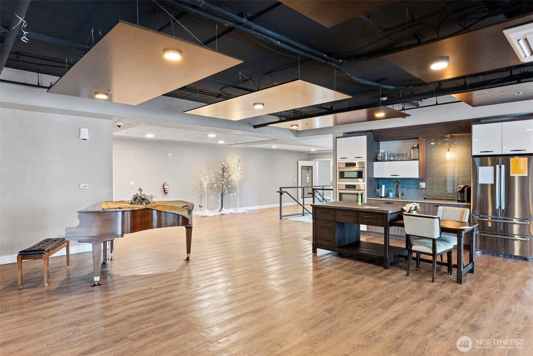 4961 Main Street, Unit 814 Tacoma, WA 98407 - Photo 26 of 37 a living room with furniture and a wooden floor