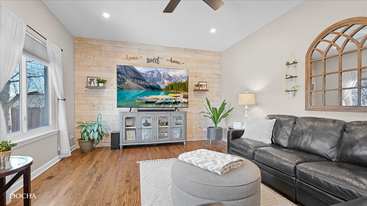 420 Raintree Drive Oswego, IL 60543 - Photo 16 of 51 a living room with furniture and a flat screen tv