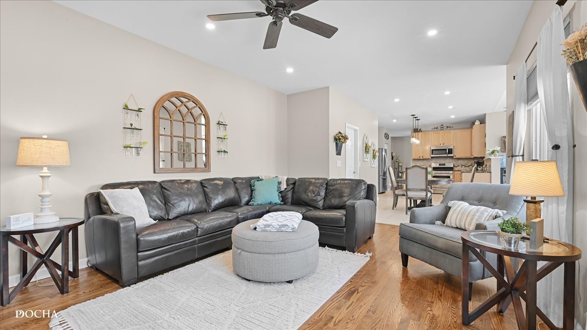 420 Raintree Drive Oswego, IL 60543 - Photo 17 of 51 a living room with furniture and a large window