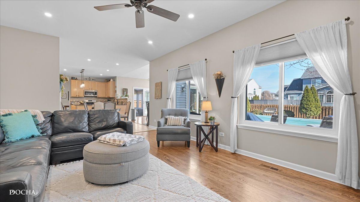 420 Raintree Drive Oswego, IL 60543 - Photo 18 of 51 a living room with furniture and a large window
