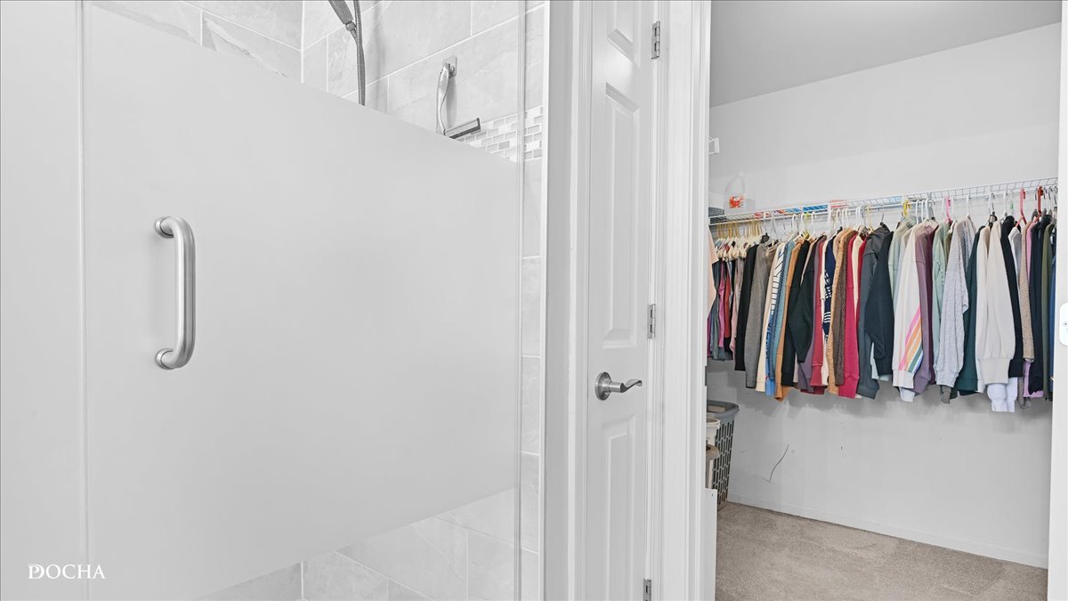 420 Raintree Drive Oswego, IL 60543 - Photo 29 of 51 a view of walk in closet with clothes
