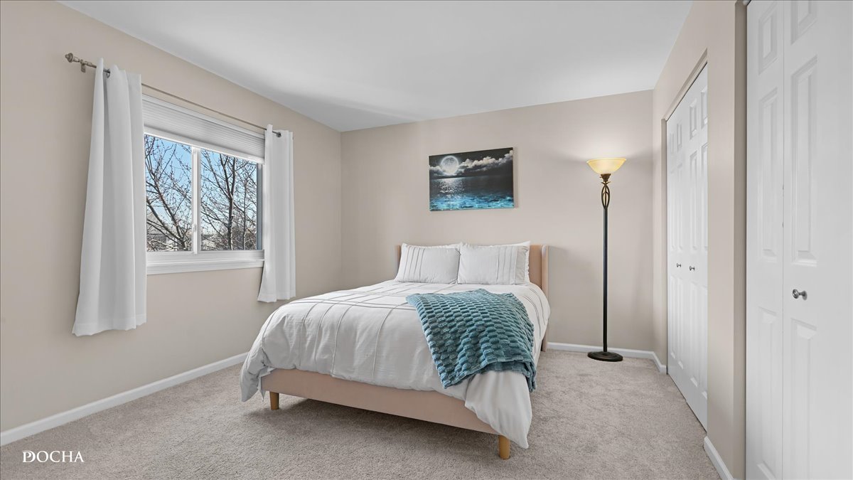 420 Raintree Drive Oswego, IL 60543 - Photo 30 of 51 a bedroom with a bed and window