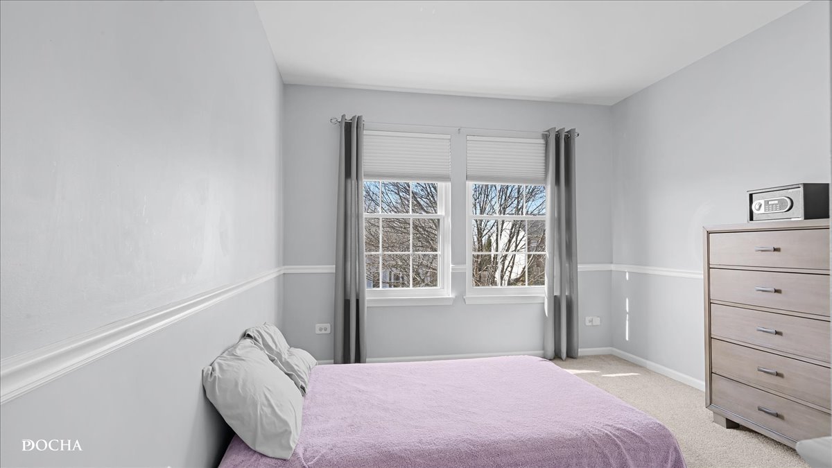 420 Raintree Drive Oswego, IL 60543 - Photo 31 of 51 a bedroom with a bed and a window