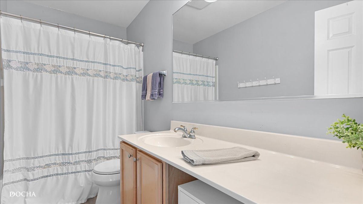 420 Raintree Drive Oswego, IL 60543 - Photo 32 of 51 a bathroom with a sink and a mirror