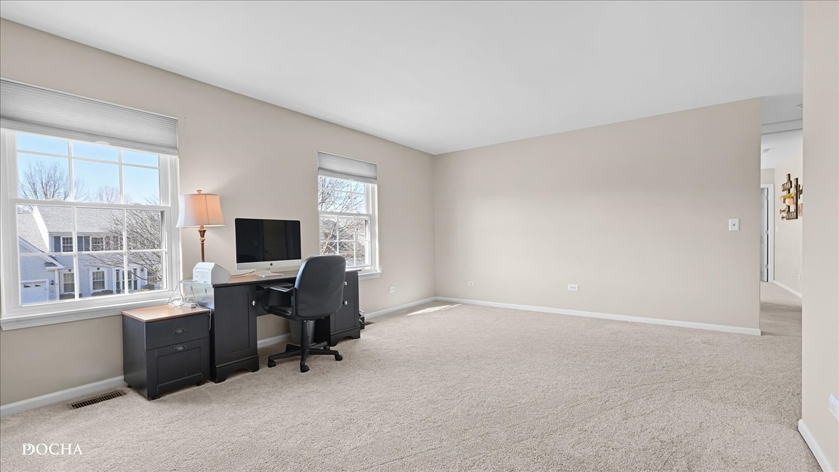 420 Raintree Drive Oswego, IL 60543 - Photo 37 of 51 a view of a livingroom with workspace and a window