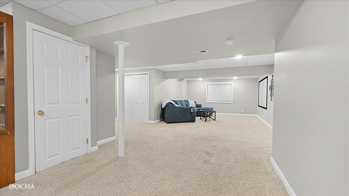 420 Raintree Drive Oswego, IL 60543 - Photo 39 of 51 a view of a livingroom with a couch and chandelier