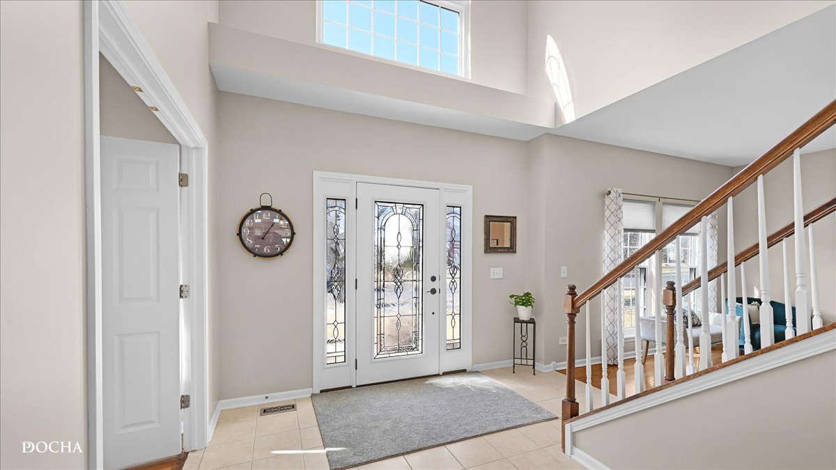 420 Raintree Drive Oswego, IL 60543 - Photo 4 of 51 a view of an entryway with wooden floor