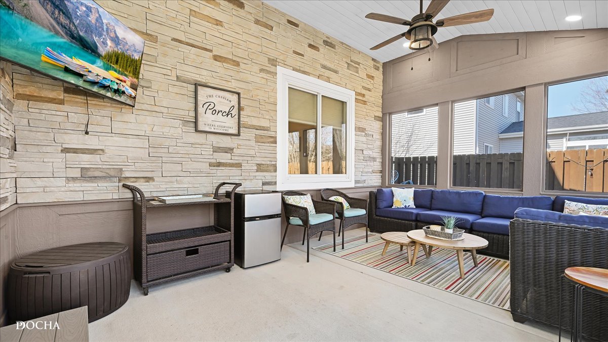 420 Raintree Drive Oswego, IL 60543 - Photo 44 of 51 a living room with furniture a ceiling fan and a window