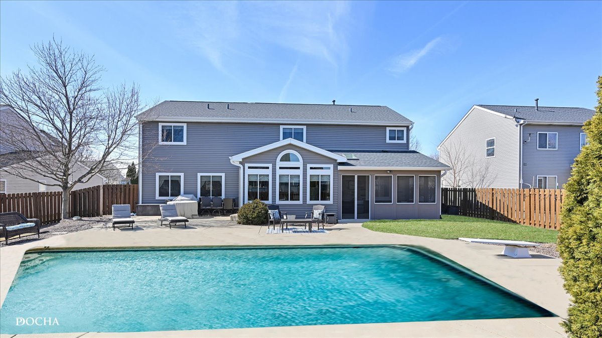 420 Raintree Drive Oswego, IL 60543 - Photo 47 of 51 a view of a house with a yard patio and fire pit