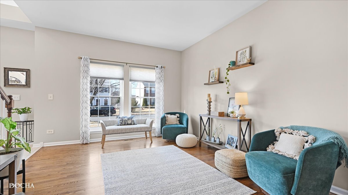 420 Raintree Drive Oswego, IL 60543 - Photo 6 of 51 a living room with furniture and wooden floor