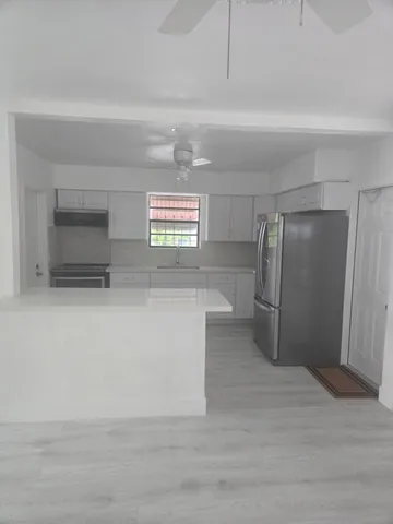 a view of an empty room and window