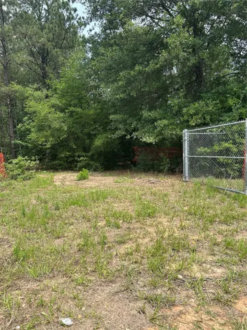 a view of outdoor space with deck and yard