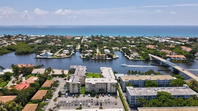 an aerial view of houses with yard