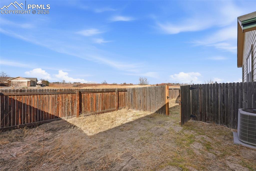 6535 Gelbvieh Road Peyton, CO 80831 - Photo 32 of 41 View of fenced backyard