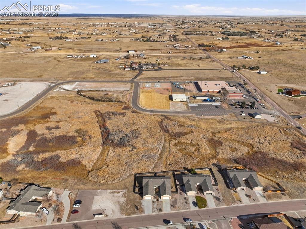 6535 Gelbvieh Road Peyton, CO 80831 - Photo 40 of 41 Aerial overview of property's location with nearby suburban area and rural landscape