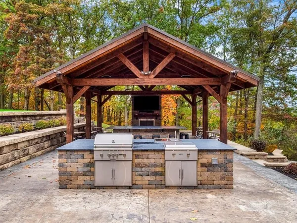 a view of a chairs and table in the patio