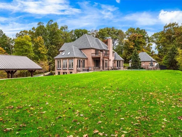 a view of a house with a big yard