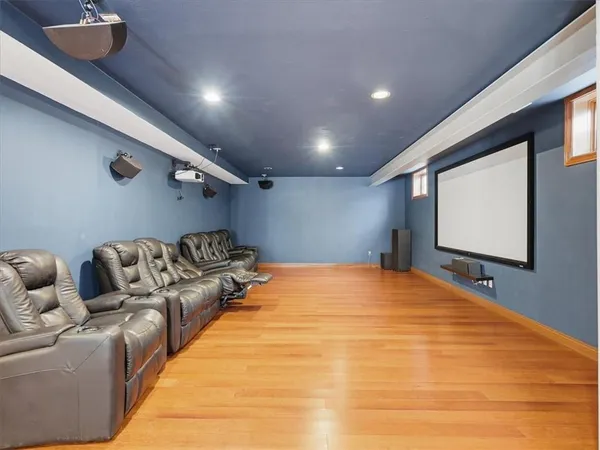 a spacious bedroom with a bed and a flat screen tv