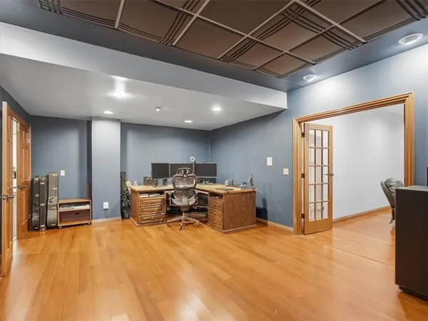 a living room with stainless steel appliances kitchen island granite countertop furniture and a kitchen view