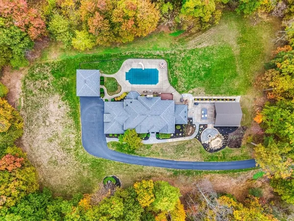 an aerial view of a house with a garden