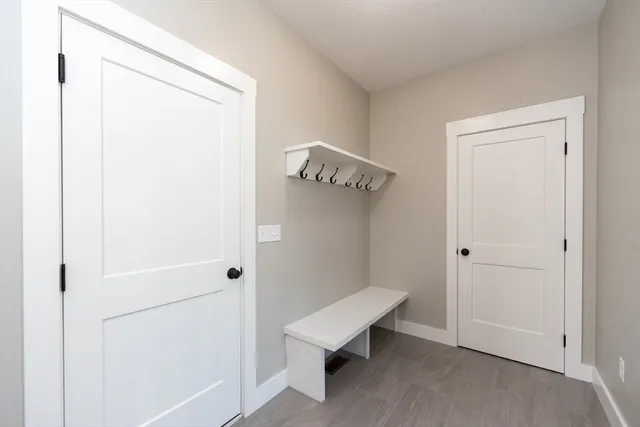 a bathroom with a sink a toilet and a window