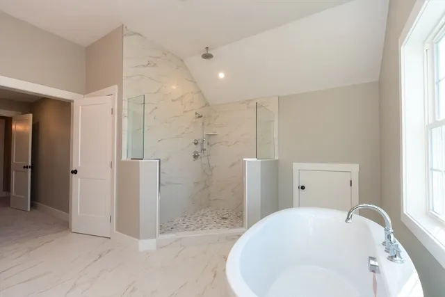 a bathroom with a shower and a sink