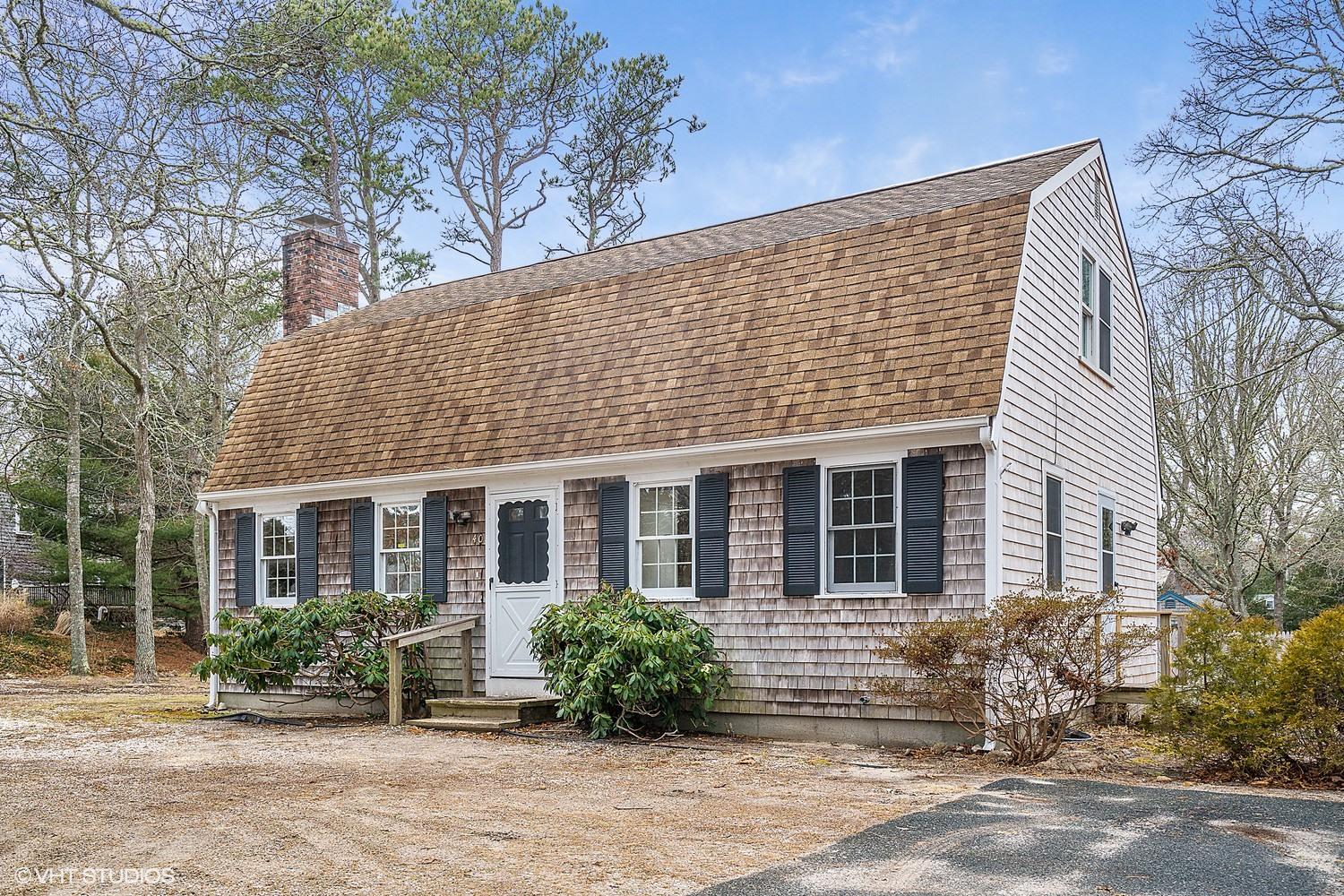 40 Nathan Road Centerville, MA 02632 - Photo 1 of 12 a front view of a house with garden