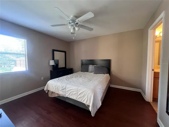 a bathroom with a sink a toilet a light fixture and a mirror