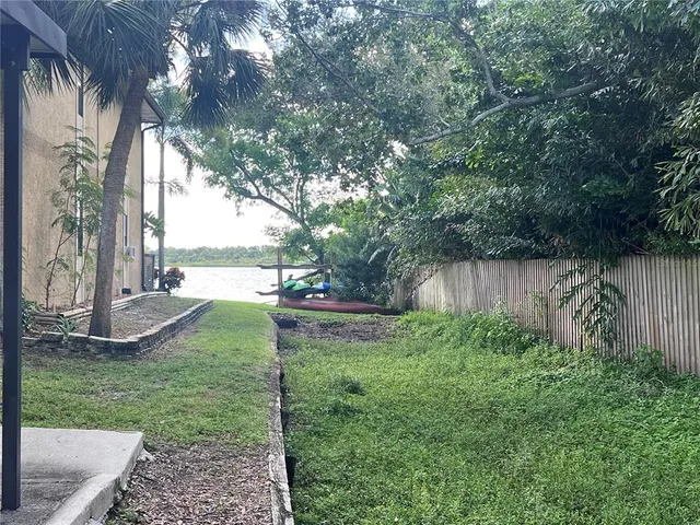 a view of a house with swimming pool and sitting area