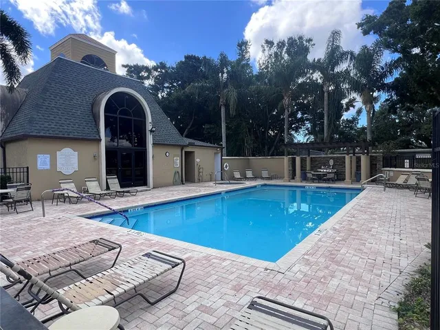 a view of a patio with swimming pool