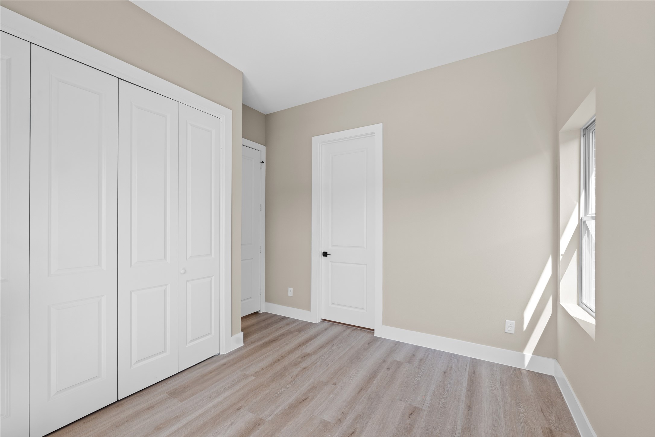 2610 Piemonte Ave Spring Spring, TX 77388 - Photo 11 of 23 an empty room with wooden floor and a window