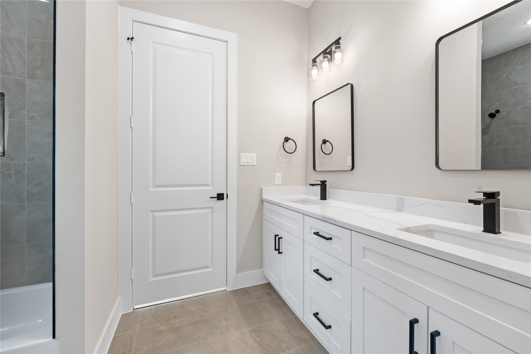 2610 Piemonte Ave Spring Spring, TX 77388 - Photo 16 of 23 a spacious bathroom with a double vanity sink and mirror