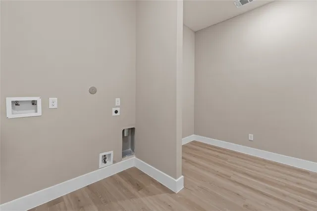 an empty room with wooden floor