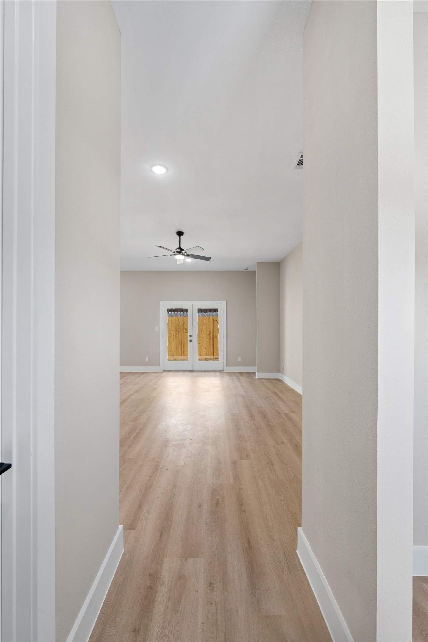 2610 Piemonte Ave Spring Spring, TX 77388 - Photo 3 of 23 a view of an empty room with wooden floor and a window