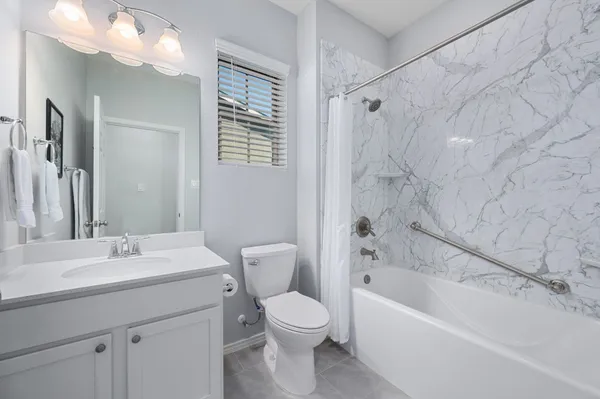 a bathroom with a sink a toilet and a bathtub