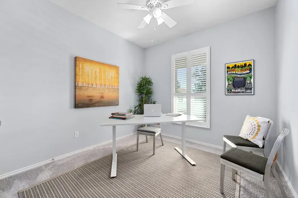 a workspace with furniture and window